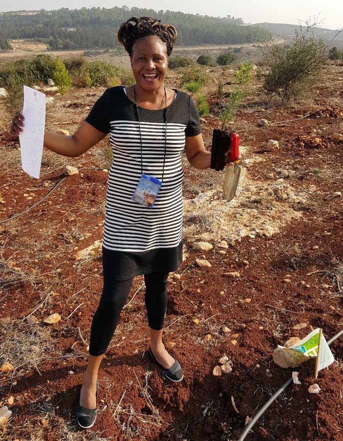 Ann Receiving Certificate after Planting Trees